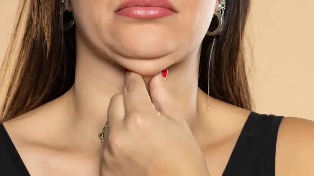 An image of a woman with double chin, sad, worried : Non Surgical Double Chin Removal Treatment in Somerset , UK